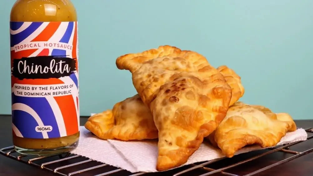 Spice Up Your Snack: Dominican Pastelitos with Chinolita Hot Sauce - Ambrosia Craft