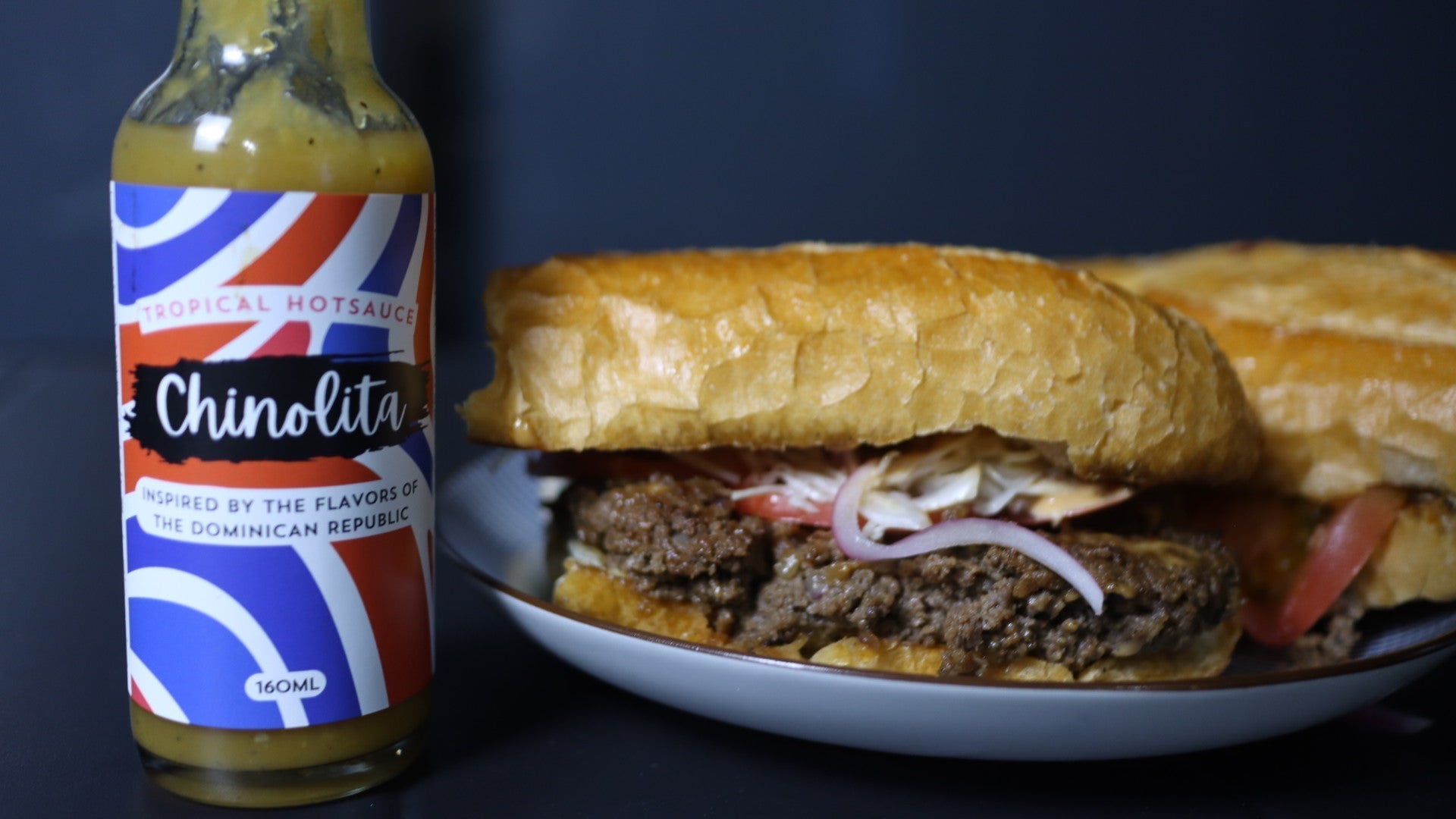Dominican chimi burger with Chinolita hot sauce